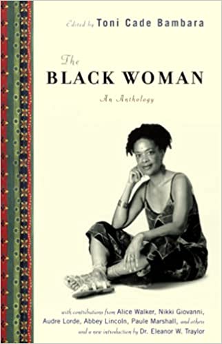 A black and white photo of Toni Cade Bambara, sitting down with feet crossed. "The Black Woman" bold text in black it written overhead, on top of a beige background. A green and red pattern lines the left side of the book cover.